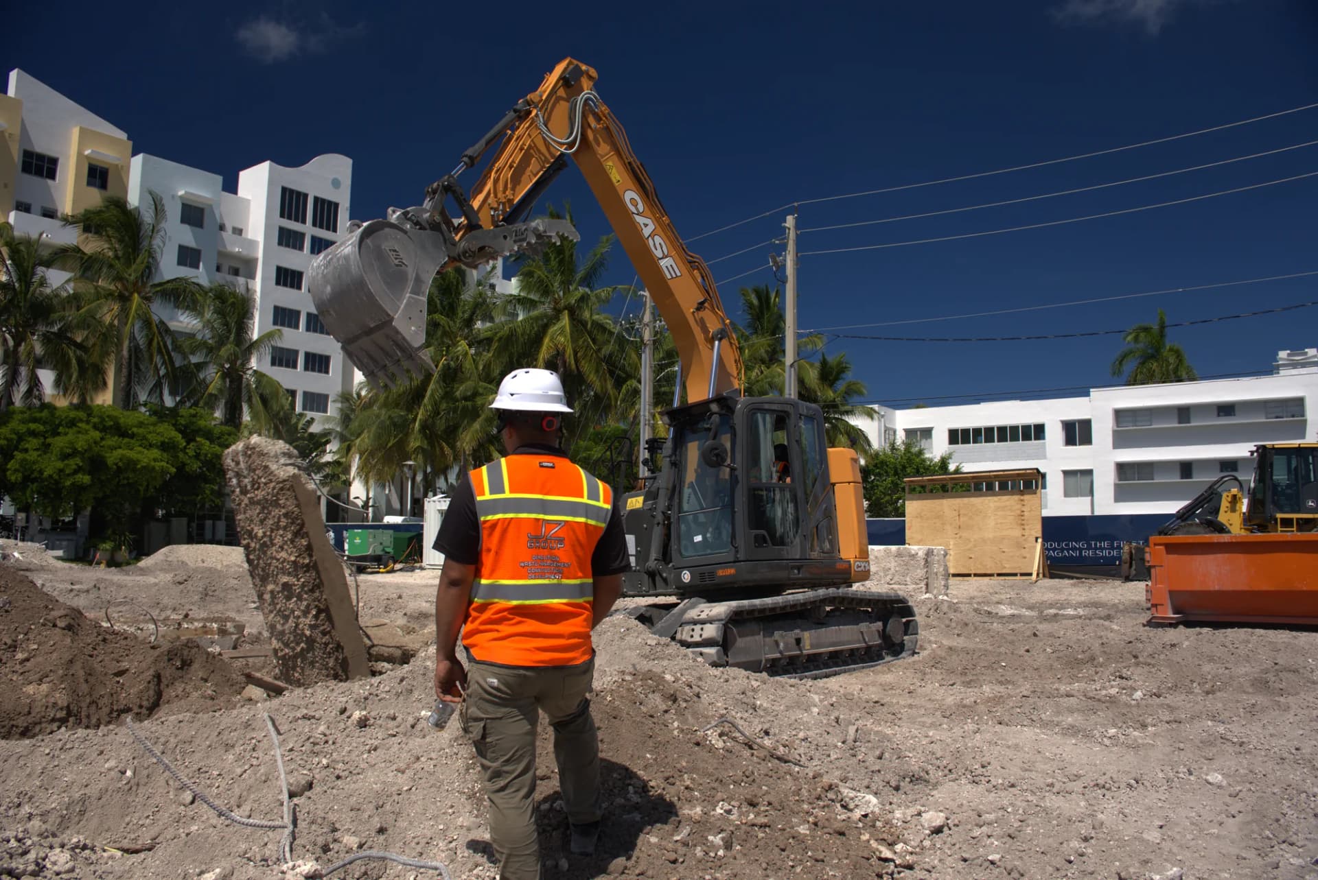 JZ field supervision alongside excavation equipment at the Pagani Residence jobsite